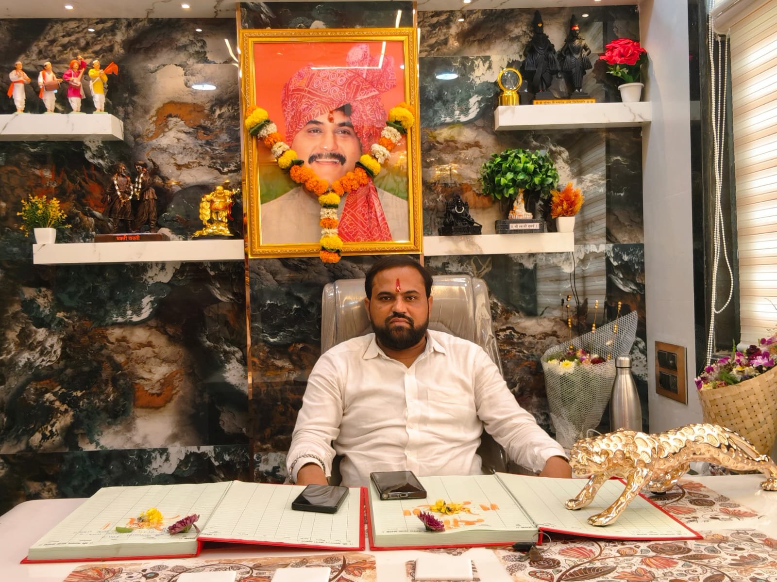Krishna Sanap, founder of Kalyani Roadlines, at his office desk